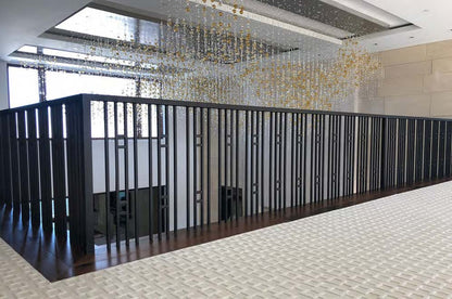 Black Rothnow wrought iron railing with decorative design, custom-sized fence for outdoor safety and aesthetic enhancement.
