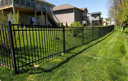 Black Rothnow wrought iron railing and fence with intricate design, customized size, suitable for outdoor security and decorative purposes.