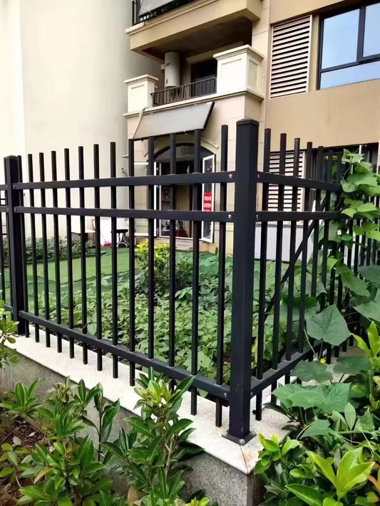 Black Rothnow wrought iron railing and fence with decorative vertical bars and ornate design, suitable for residential or commercial use.