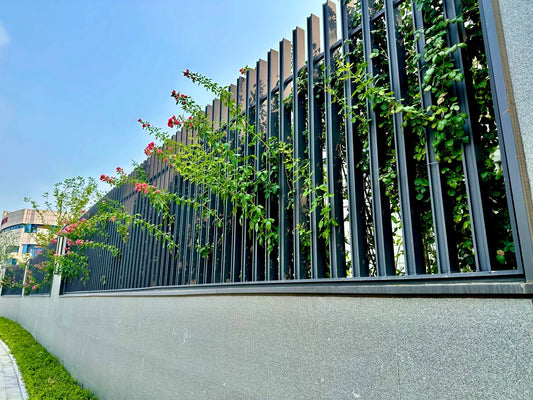 Black Rothnow wrought iron railing and fence with intricate design, customizable size, ideal for outdoor safety and decorative fencing.