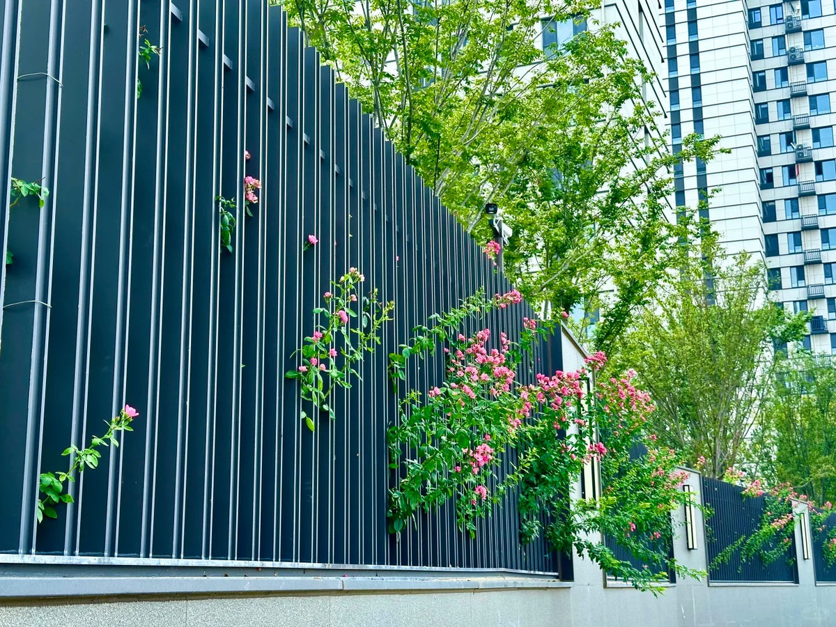 Black Rothnow wrought iron railing and fence with intricate design, custom-sized for outdoor security and decorative fencing.