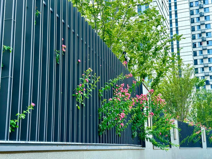 Black Rothnow wrought iron railing and fence with intricate design, custom-sized for outdoor security and decorative fencing.