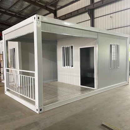 Rothnow Prefab House RNPH01: black steel structure container house with detachable design, assembled on a construction site.