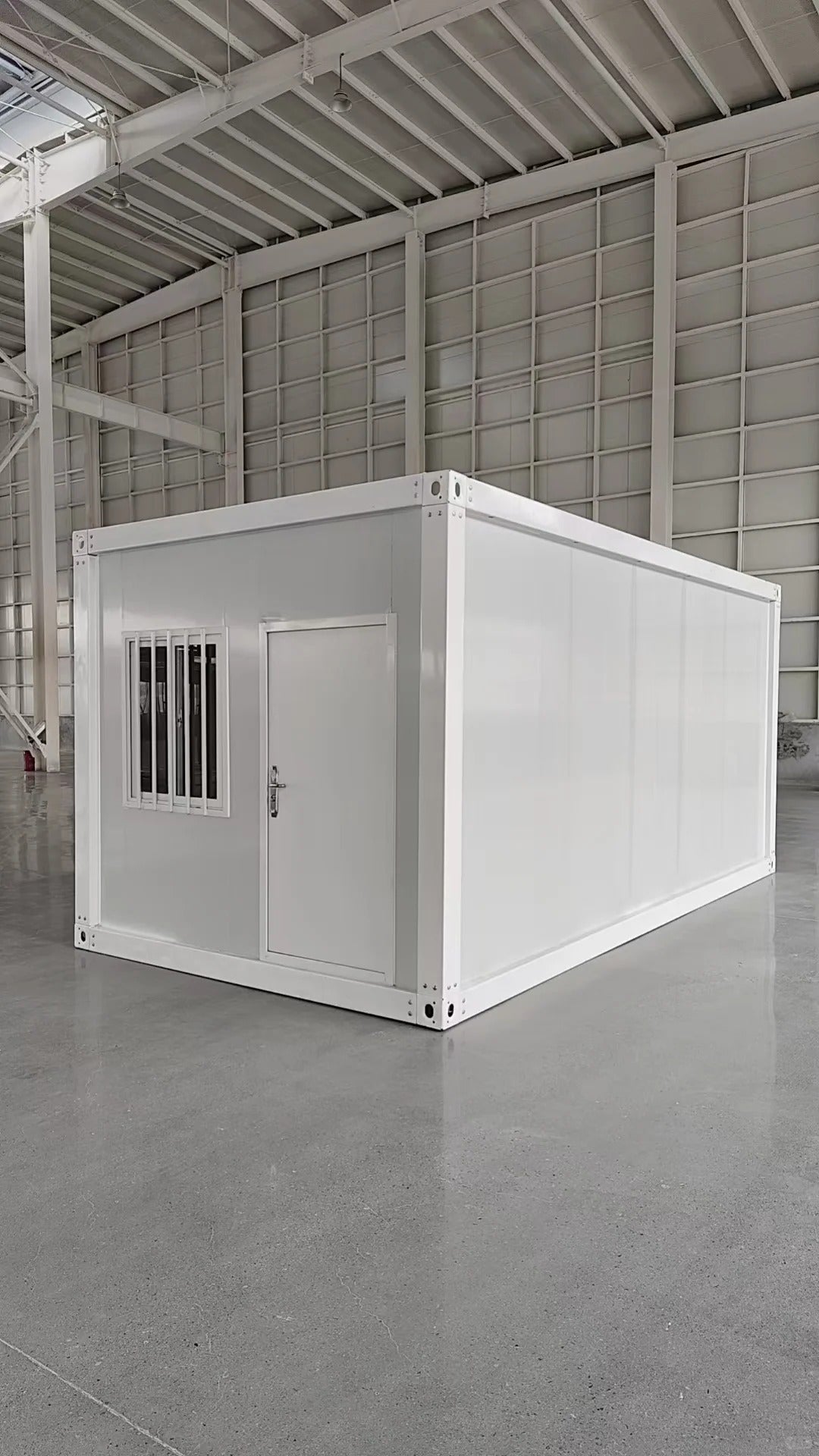 Rothnow® Prefab Steel Structure House RNPH03 in black, flat pack design, with modern exterior and large windows.