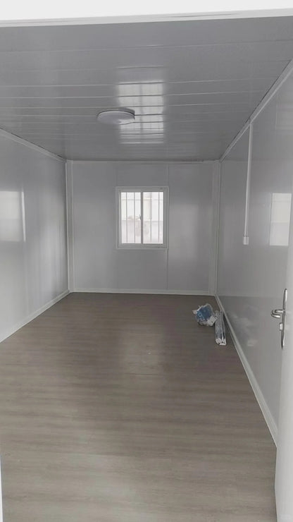 Black Rothnow Prefab House RNPH03 flat pack steel structure building with modern design, shown from front view.
