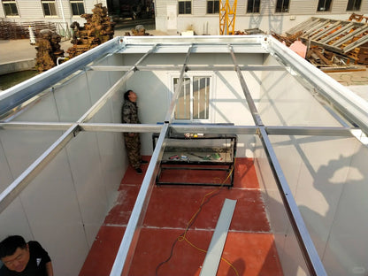 Black Rothnow Prefab House RNPH04 flat pack steel structure building, shown assembled with modern design and durable materials.
