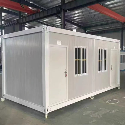 Rothnow Prefab House RNPH04 flat pack steel structure building, black exterior, assembled on a flat surface.