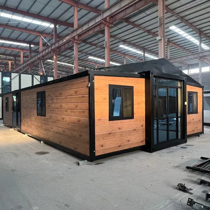 Black Rothnow Prefab House RNPH07 by Rothnow, steel structure expandable building with modern design, shown in detailed exterior view.