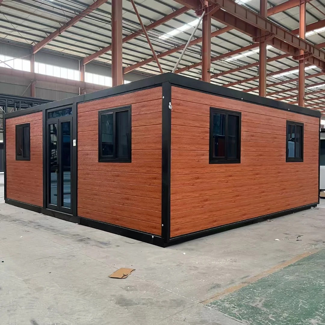 Black Rothnow prefab house RNPH07 with steel structure, expandable design, shown with its modern, sleek exterior and large windows.