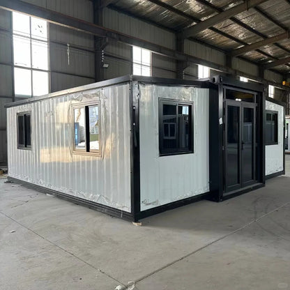 Black Rothnow prefab steel house RNPH08 expandable building with large windows and modern design, shown from front view.