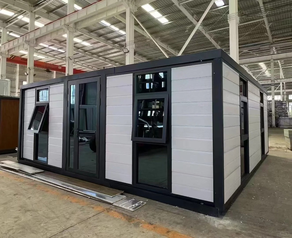 Black Rothnow® Prefab House RNPH08 expandable steel structure building with large windows and modern design.