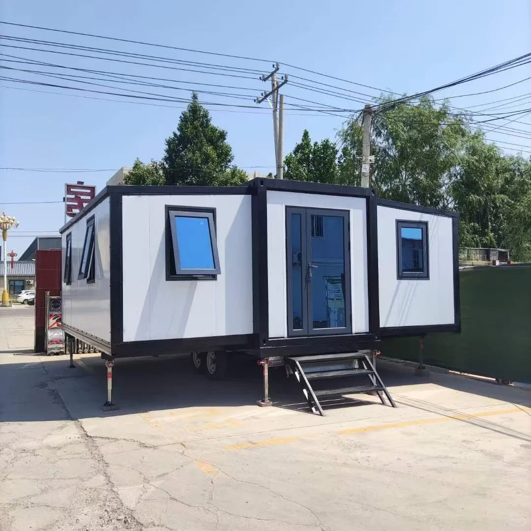 Black Rothnow Prefab House RNPH08 expandable steel structure building with large windows and modern design.