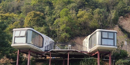 Black Rothnow Space Capsule House, steel structure building, RNSH01-V3 model, modern compact design, large windows, outdoor setting
