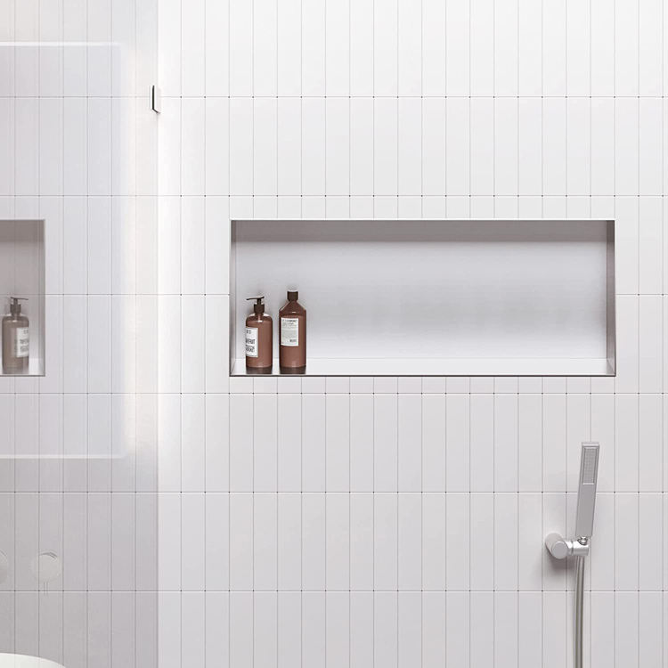 White Rothnow® shower niche wall shelf with mirrored interior for bathroom storage and organization.
